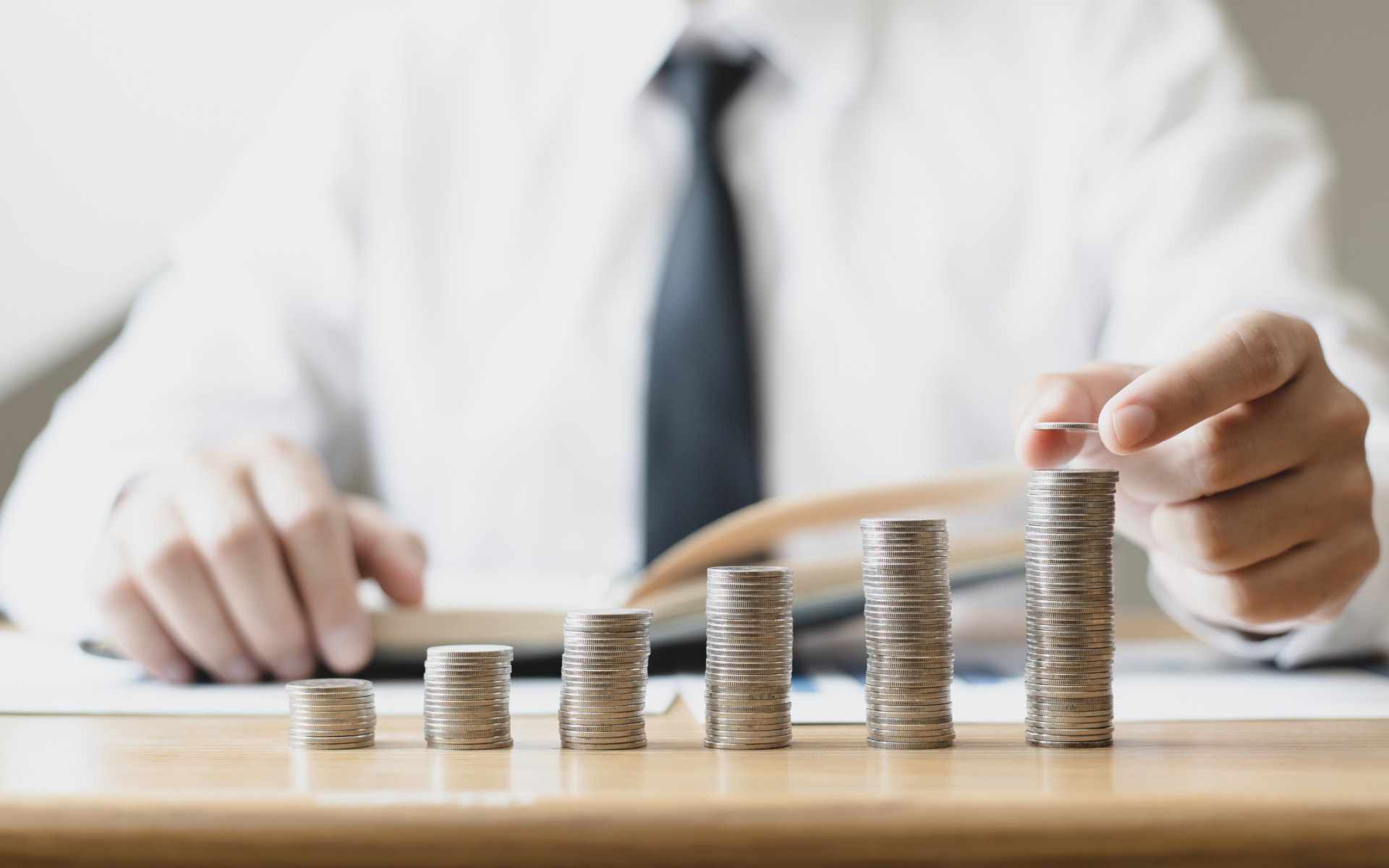 Employee weighing job offer and counteroffer at their desk
