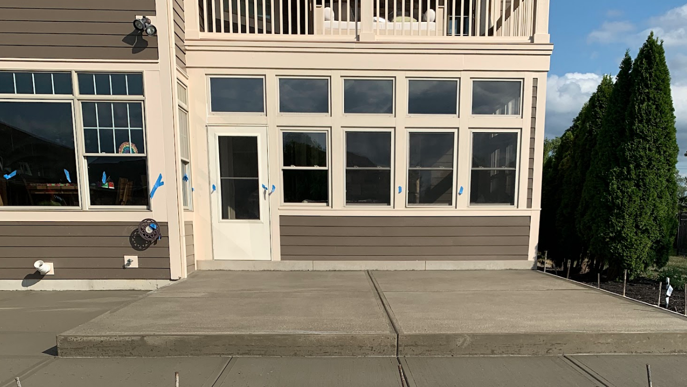 A large building with window and door installation.