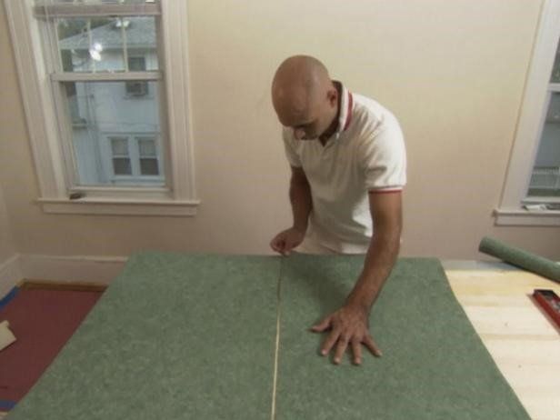 Man Cutting wallpaper