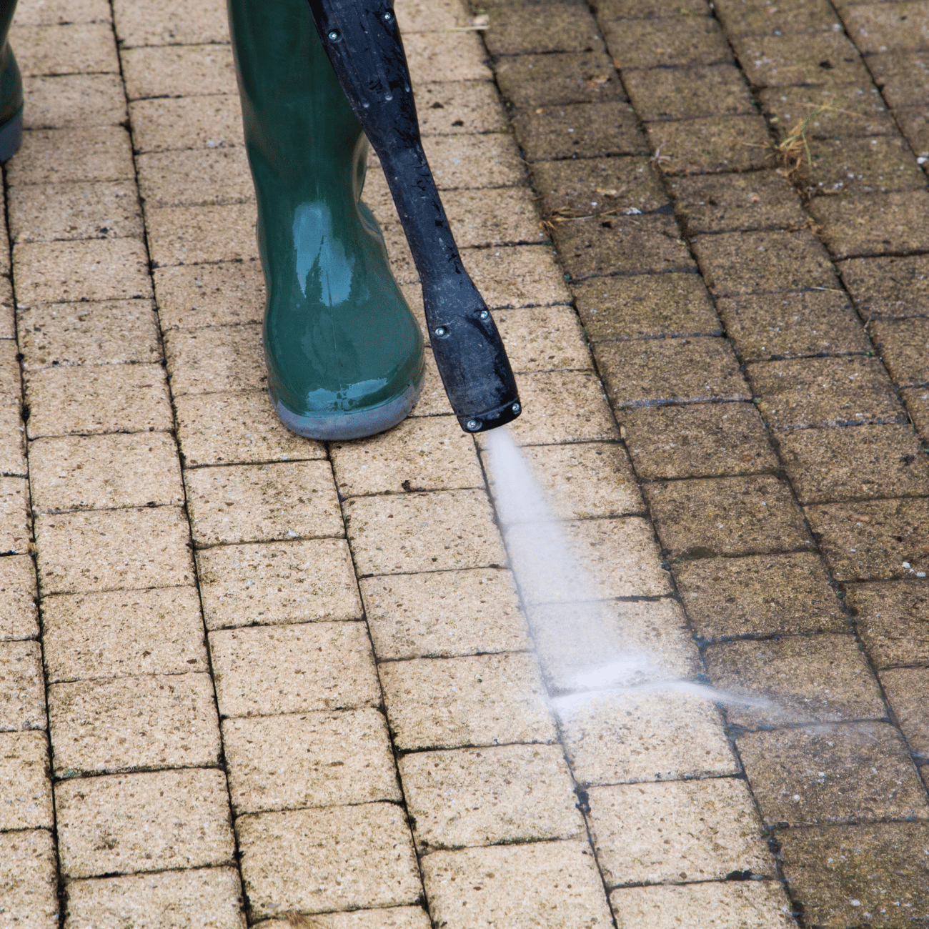 A man Pressure Cleaning a house
