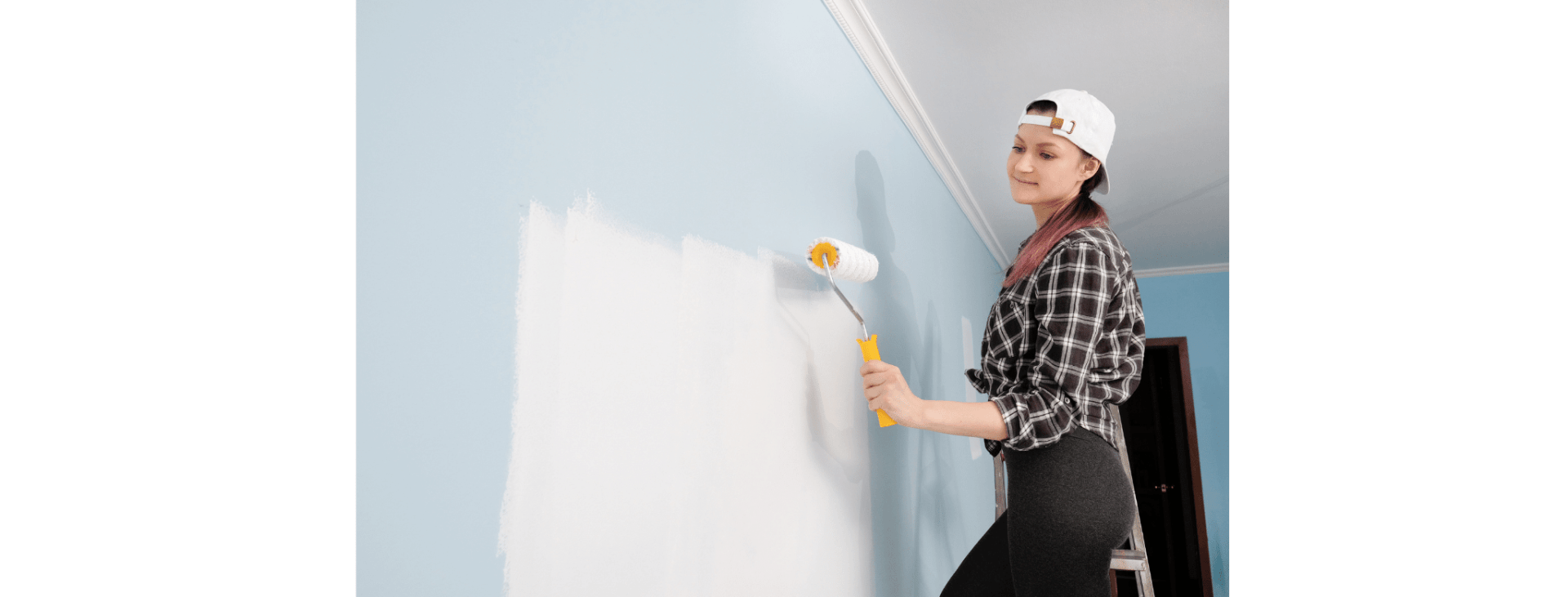girl painting a wall