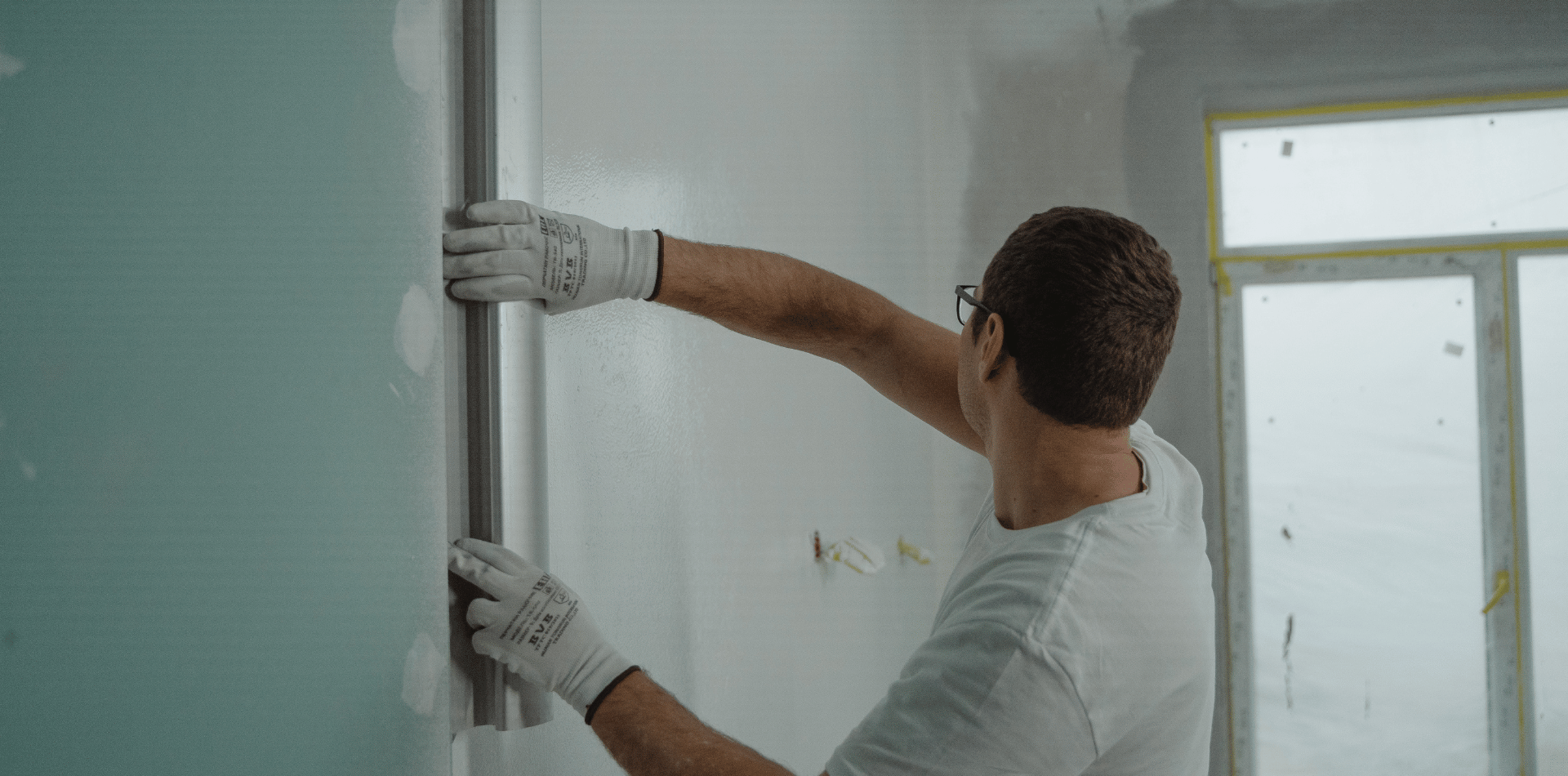 Professional painter preparing a wall surface