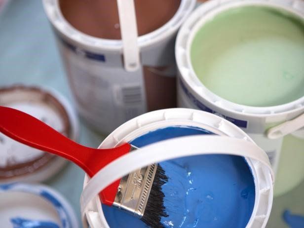 Tin of paint ready to be applied to a wall