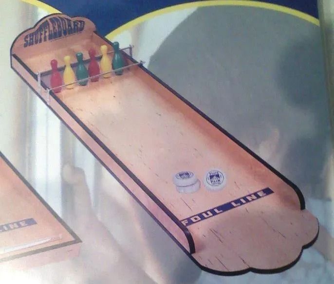 A wooden bowling alley with the word bowling on it