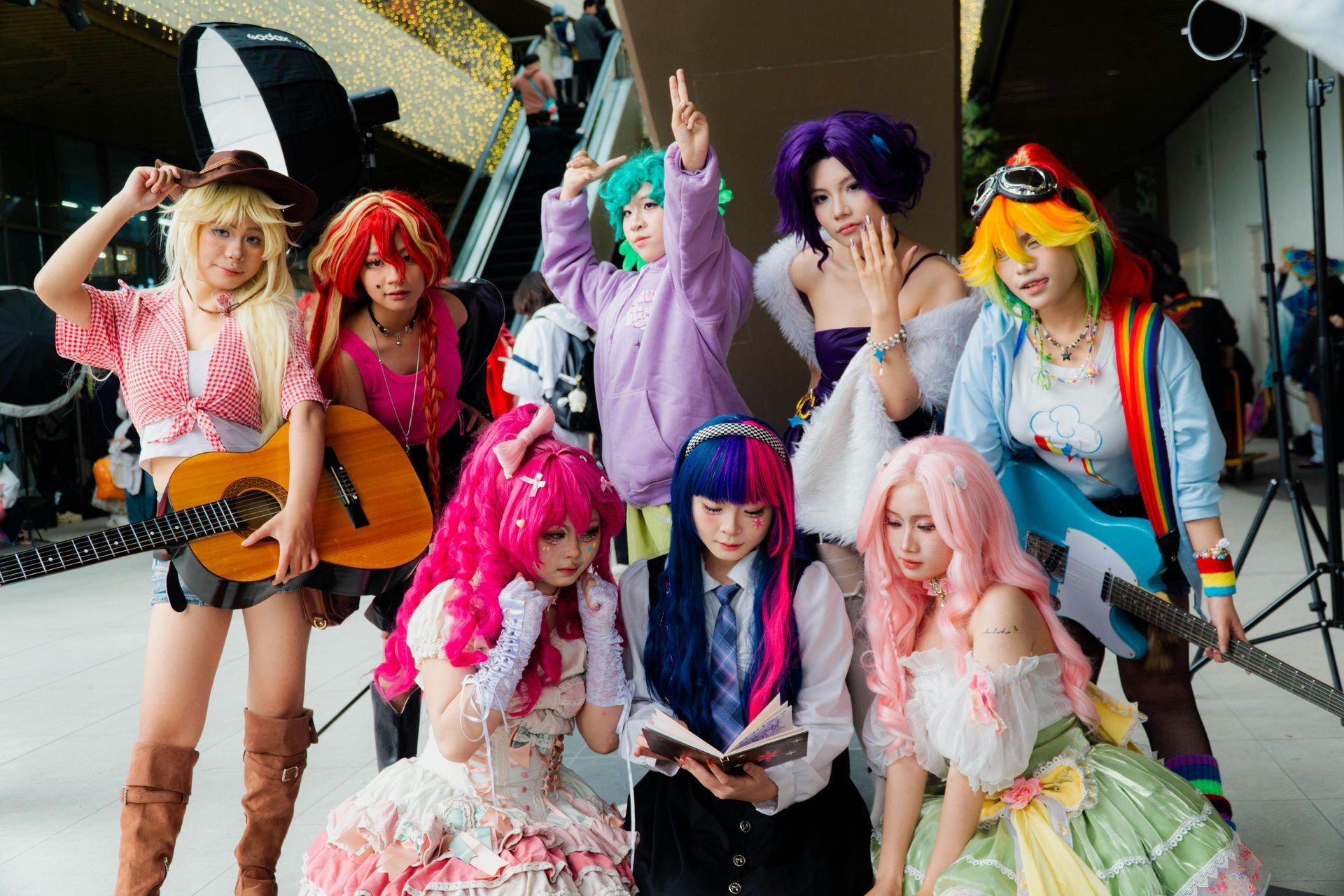 A group of women dressed in costume are posing for a picture.