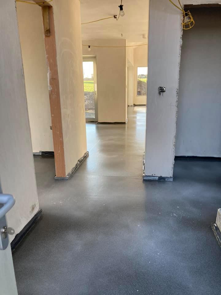 There is a concrete floor in the middle of the room.