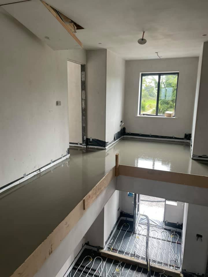 A room with a ceiling that is missing and a ceiling fan.