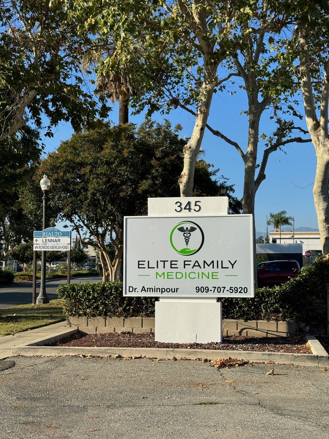 image of Elite Family Medicine logo on a sign outside the office