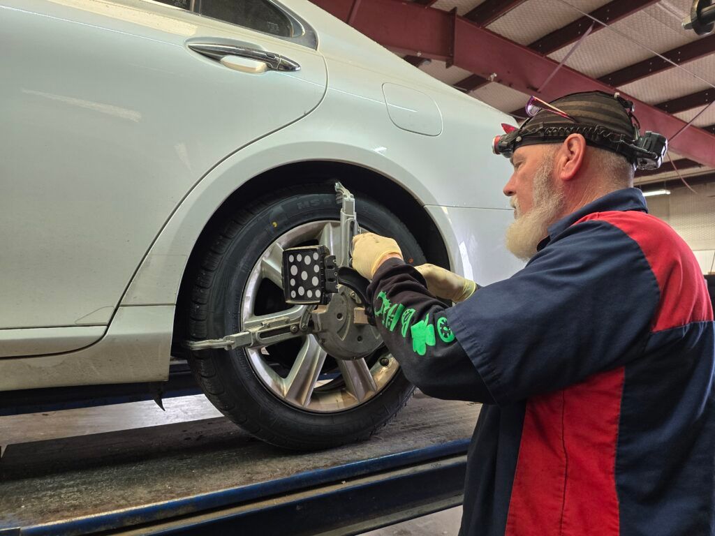 Technician Conducting Wheel Alignment | Advanced Tire & Auto Service