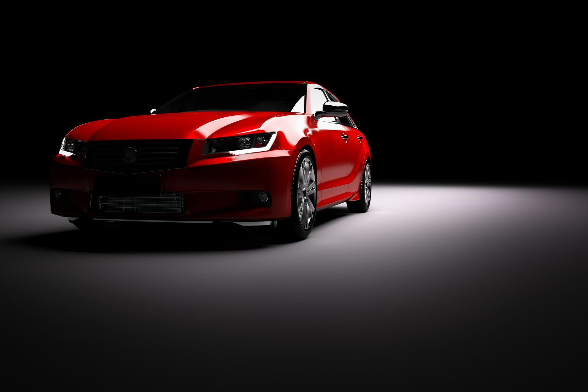 A man is working on a car engine with a multimeter.