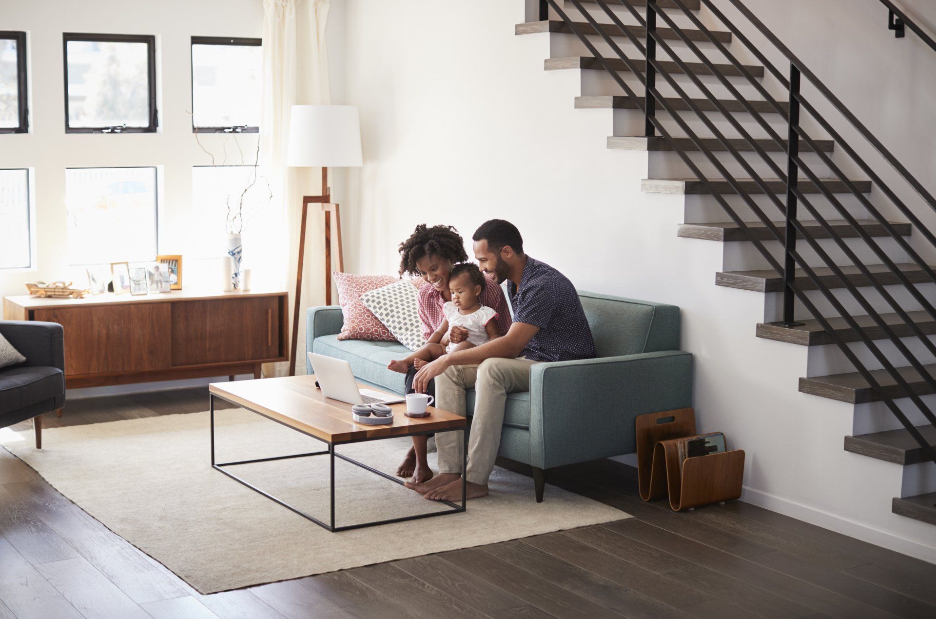 Parents with their young daughter enjoying some quality time in their accessory dwelling unit (ADU) casita.
