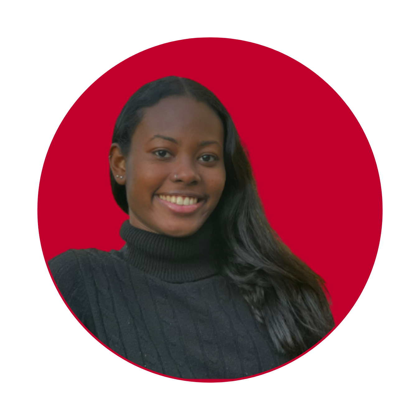 A woman in a black sweater is smiling for the camera