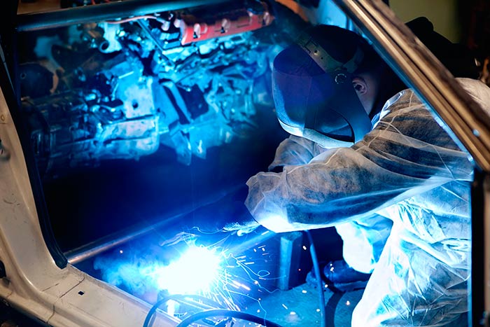 Car Body — Mechanic with Protective Mask Welding Car Body in Louisville, KY