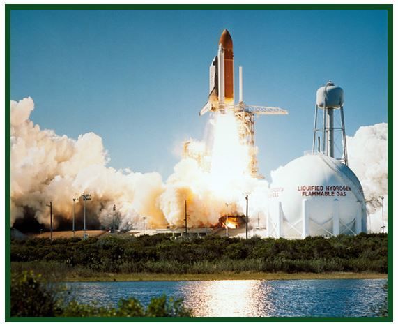 Space Shuttle Challenger lifting off.