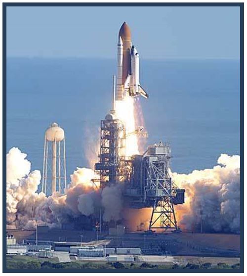 Space Shuttle Challenger Lifting off of launch pad