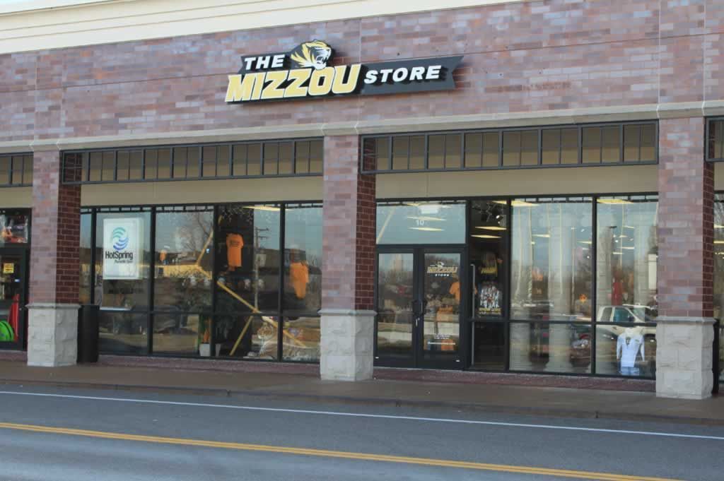 A brick building with a sign that says the mizzou store