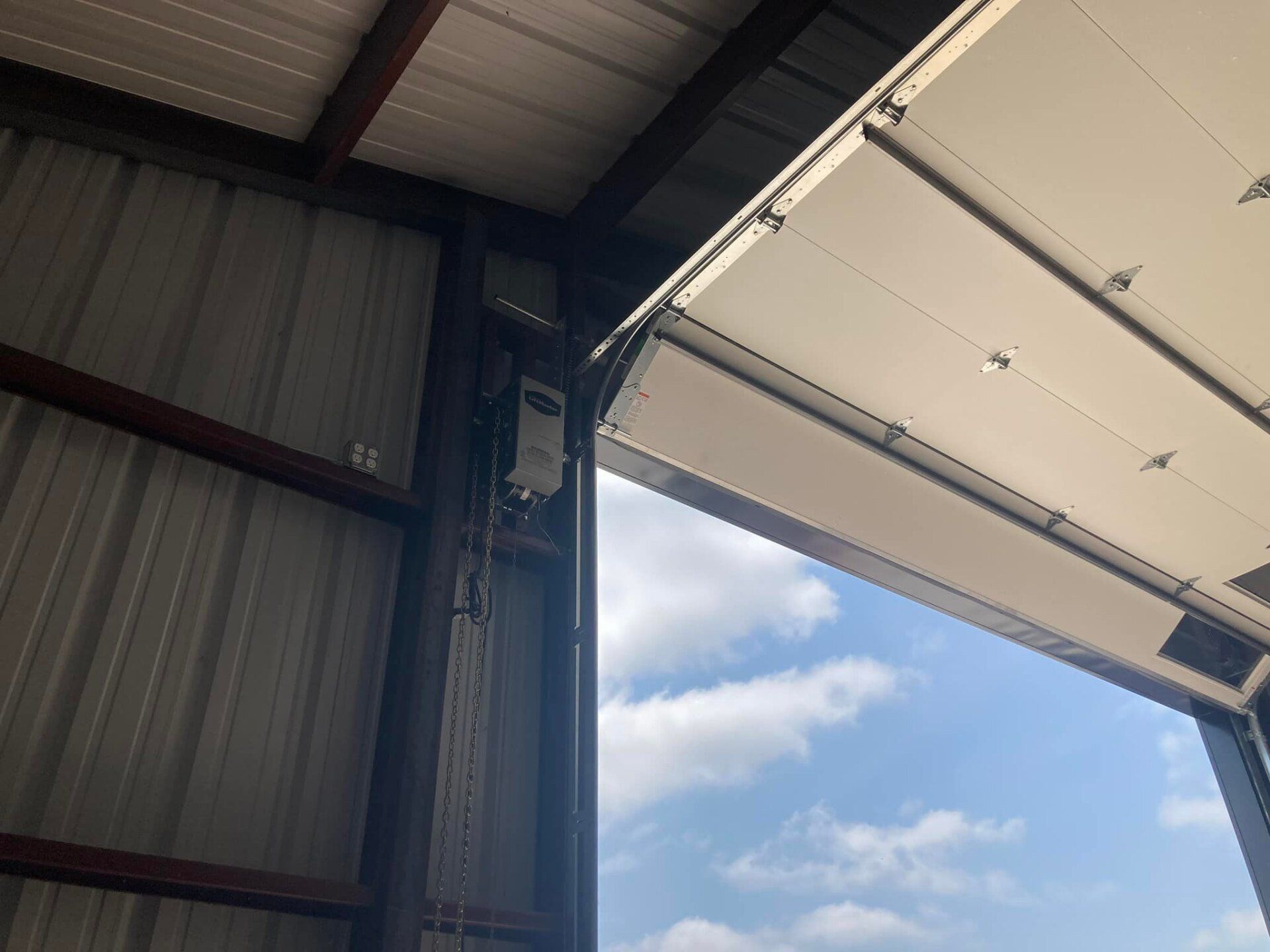 A Photo Of Consisting Steel Wall And Blue Sky — Denison, TX — North Central Door and Gate