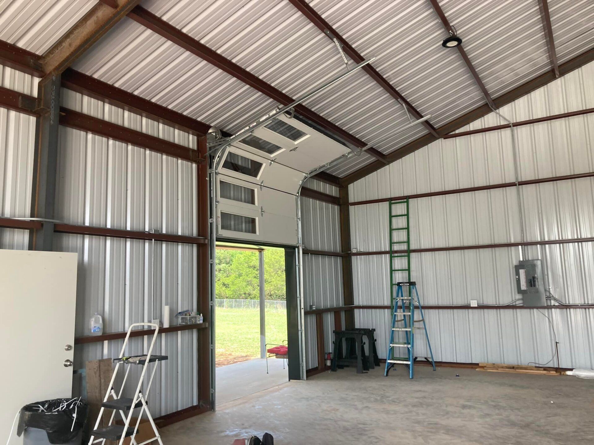 A White Warehouse And Opened Door — Denison, TX — North Central Door and Gate