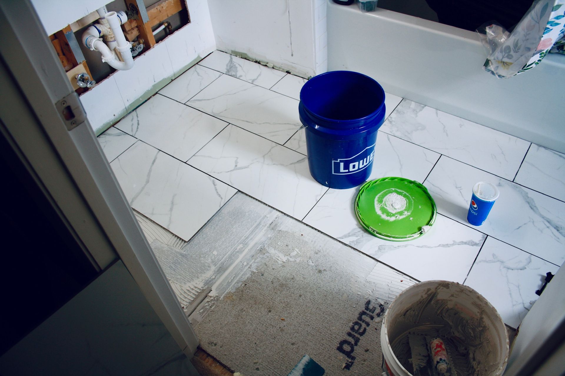 A blue bucket with the word law on it