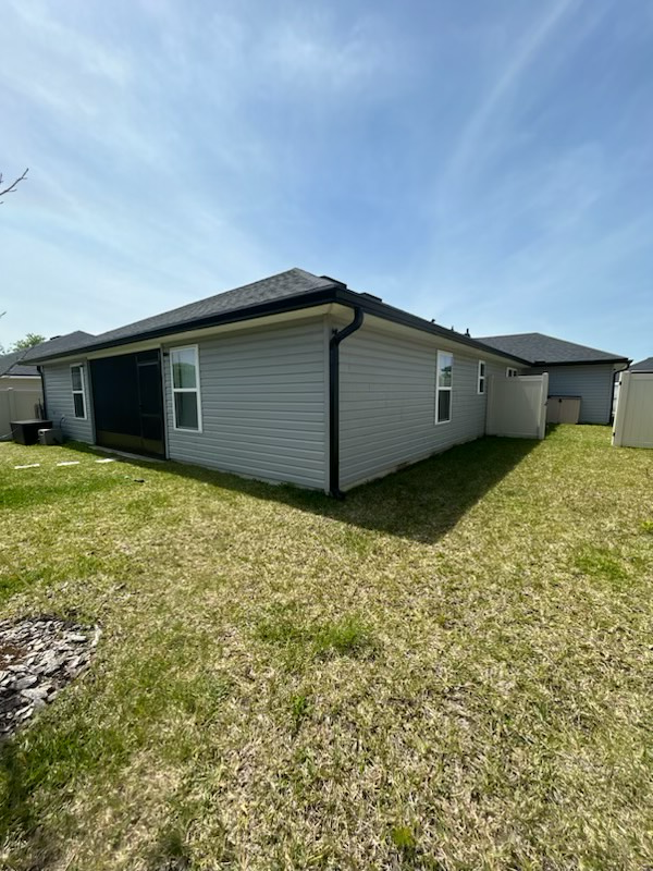 a house with a lot of grass in front of it