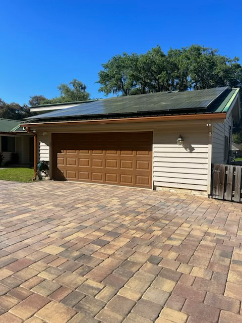 a garage with solar panels on the roof