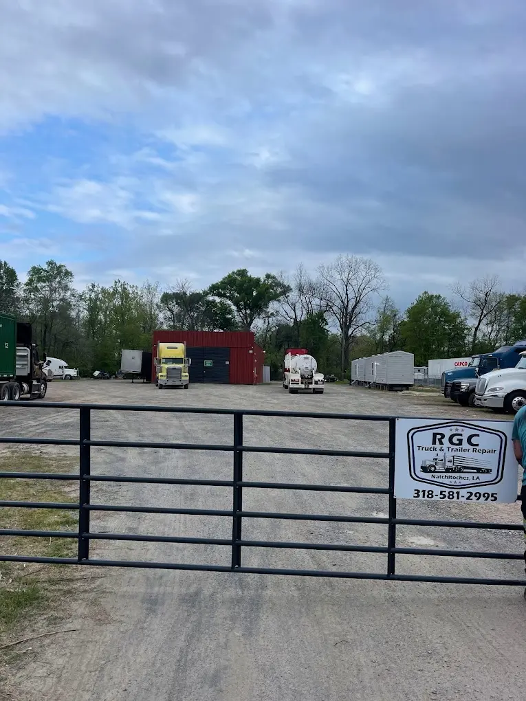 A fence with a sign that says rgc on it