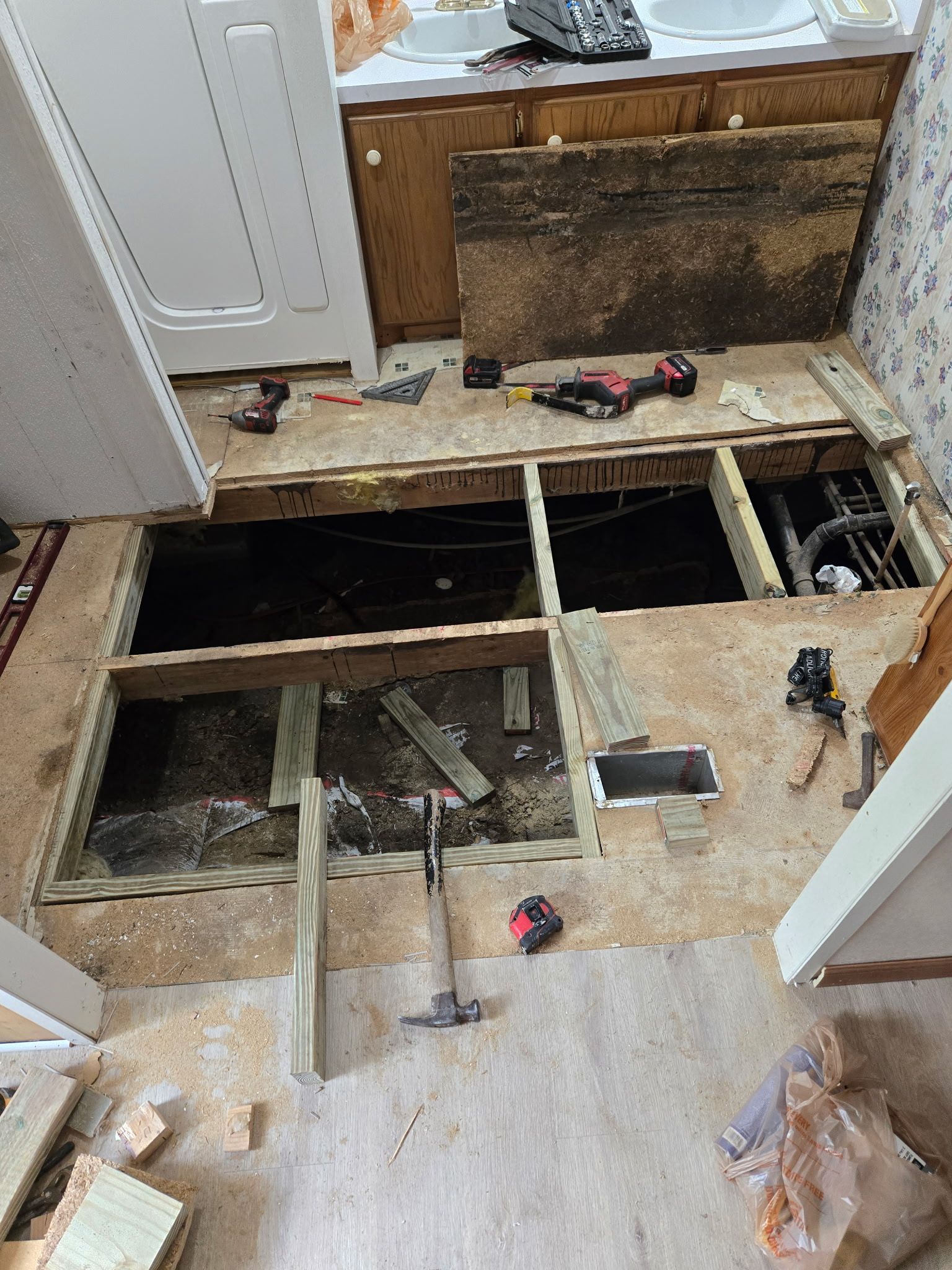 A bathroom is being remodeled and the floor is being removed.