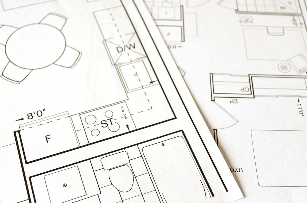 Eine schwarz-weiße Zeichnung eines Hauses mit dem Buchstaben f darauf