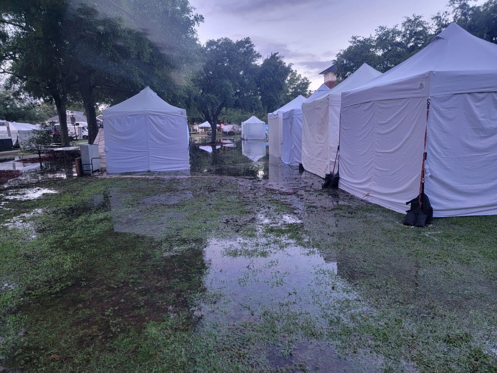 Water covers areas of John. B. Foley Park just before the start of the 2025 Art in the Park festival