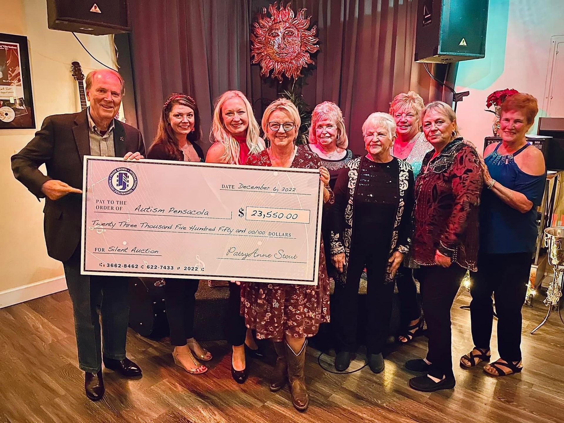Frank Brown International Songwriters Festival donation to Autism Pensacola in 2022