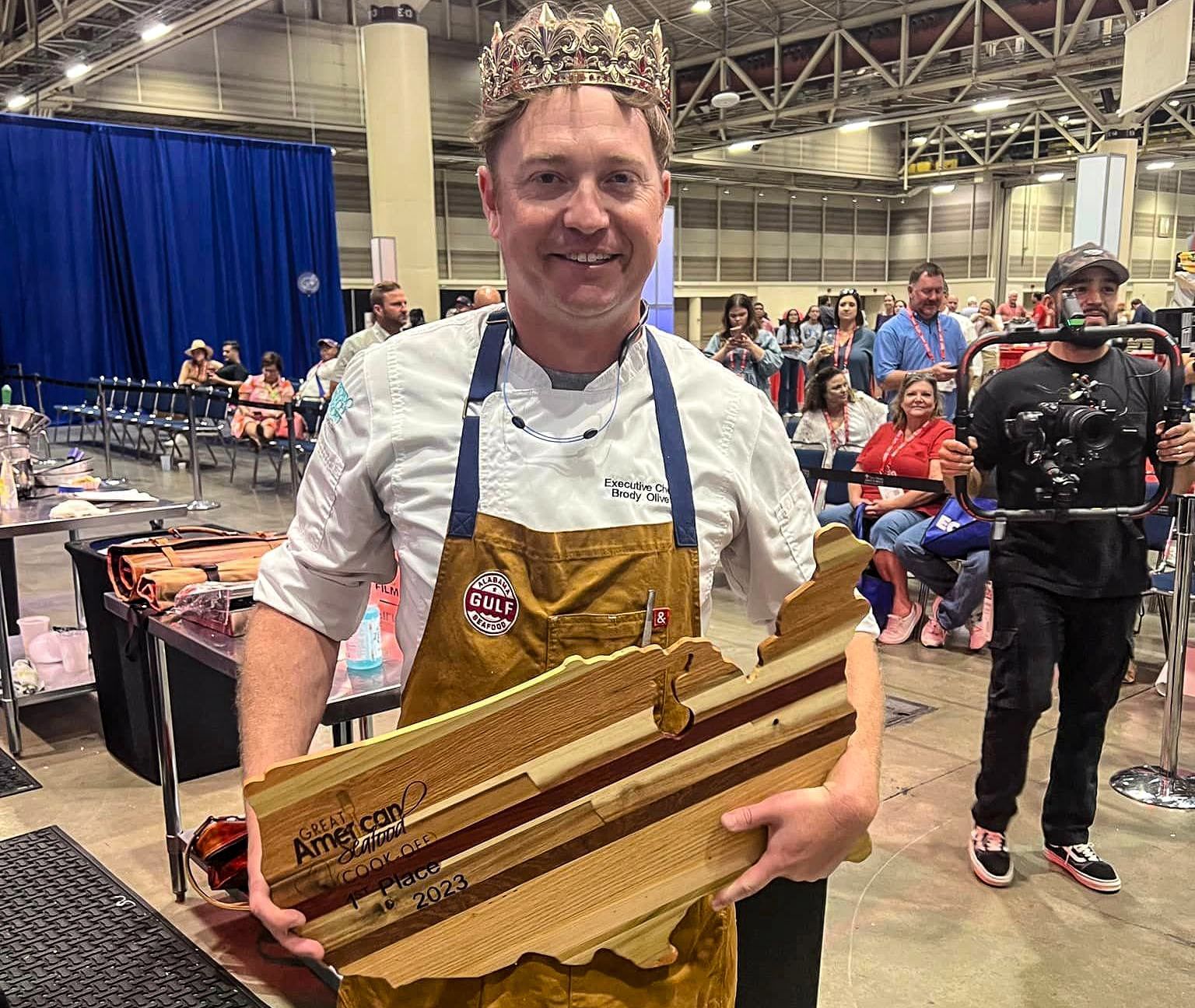 Chef Brody Olive with his 2023 Great American Seafood Cook Off Trophy