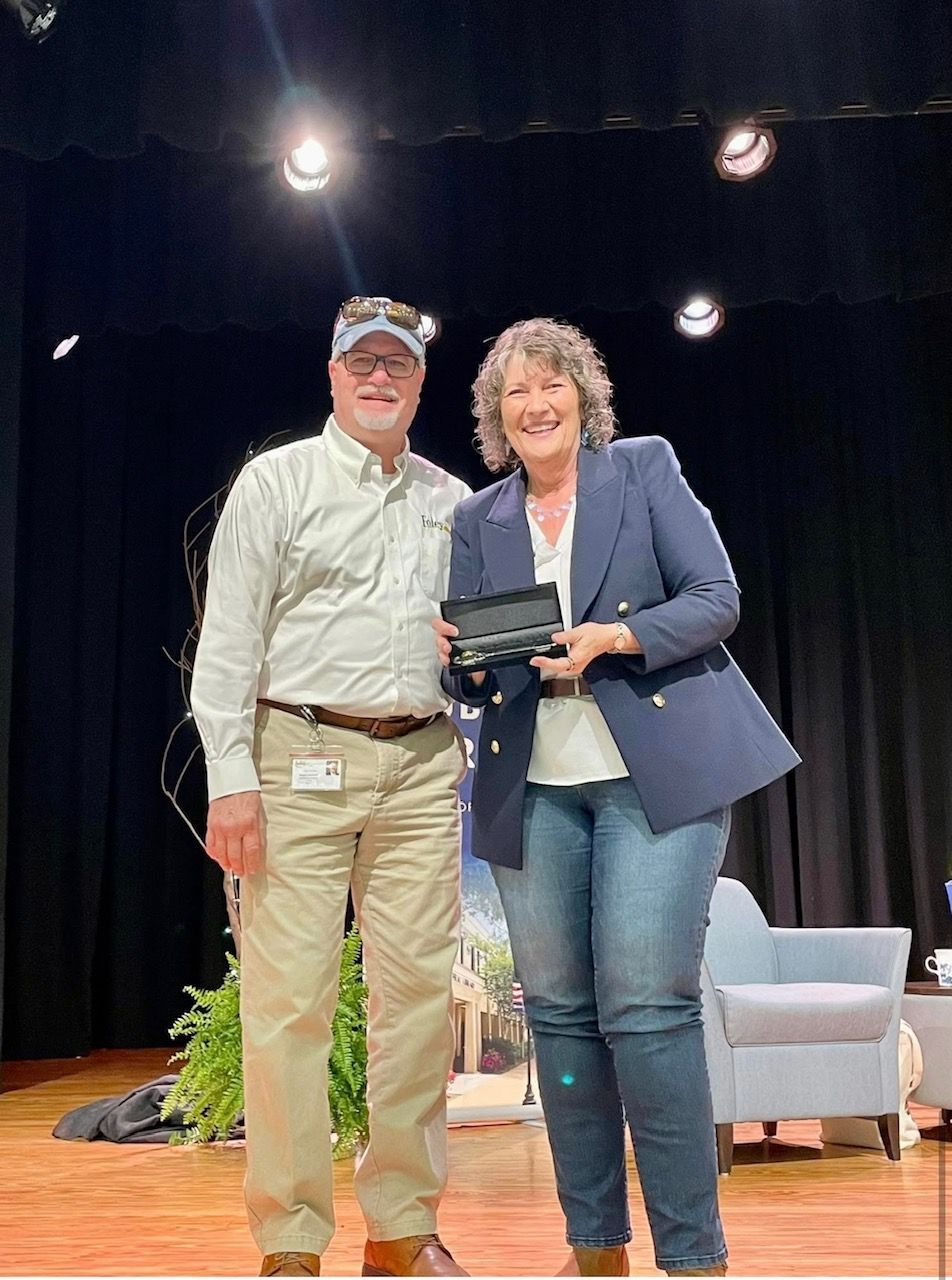 Author Colleen Coble receives the Key to the City of Foley from Mayor Ralph
Hellmich during a previous visit to the Foley Public Library.