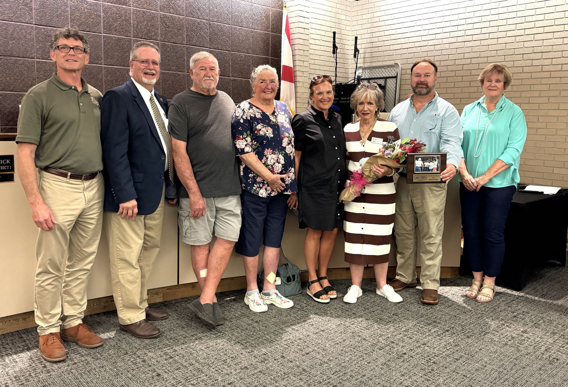 Foley Main Street Board Member Deborah Mixon, third from right, received the Main
Street Hero Award for service to efforts to improve downtown. She received the award at a
recent meeting of the Foley City Council.