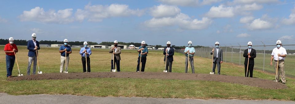 Officials at a groundbreaking for a new air traffic control tower in Gulf Shores, Alabama.