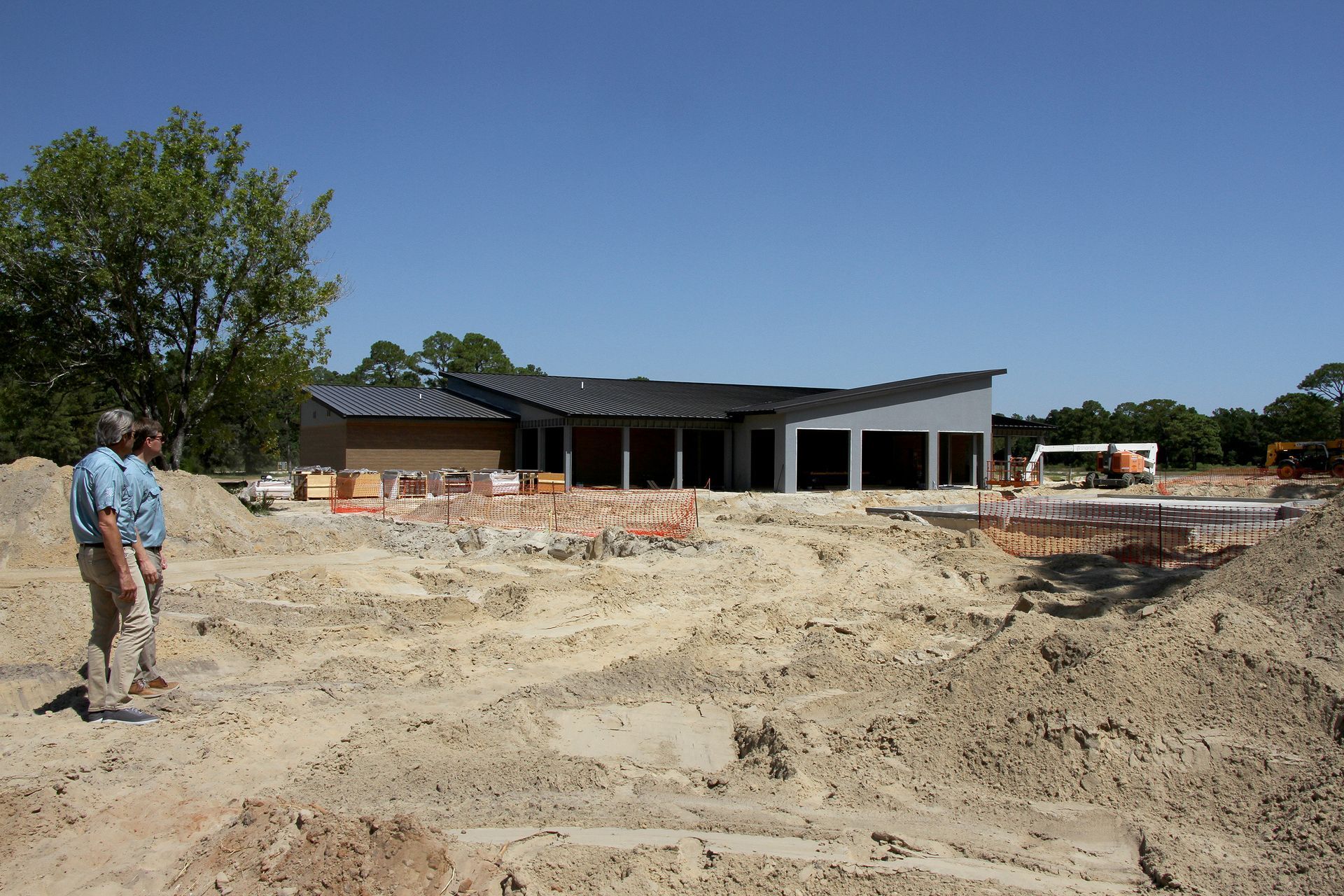 Matthew Capps and Matt Young check on the progress of the new campground's activities center.