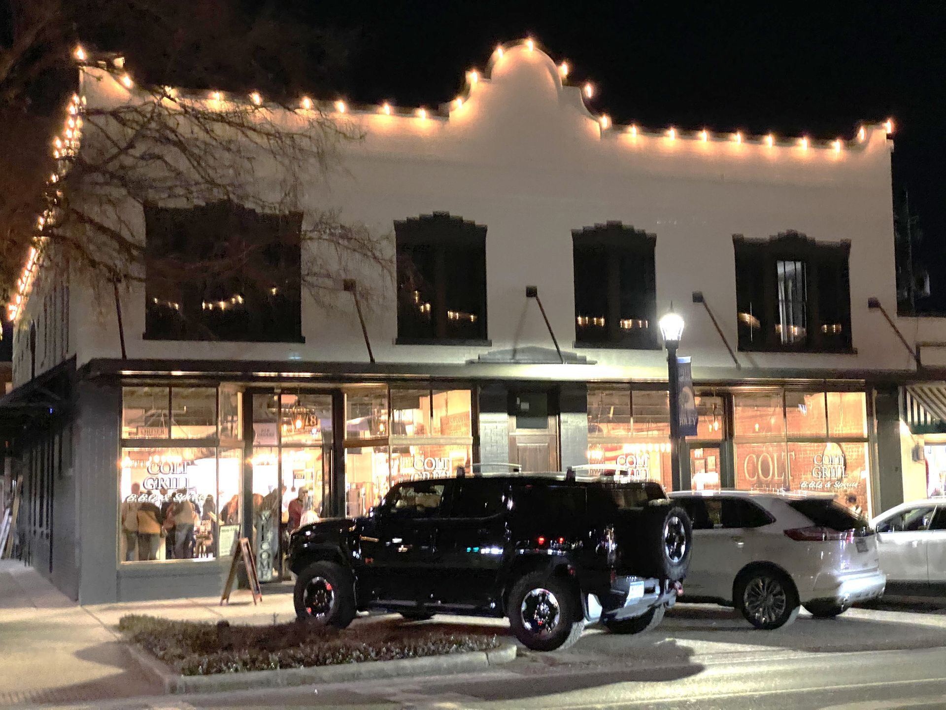 Lights glow along buildings in downtown Foley. The city and local property owners have been working to place LED lights on buildings in the historic downtown area. The lights were switched on Thursday night.