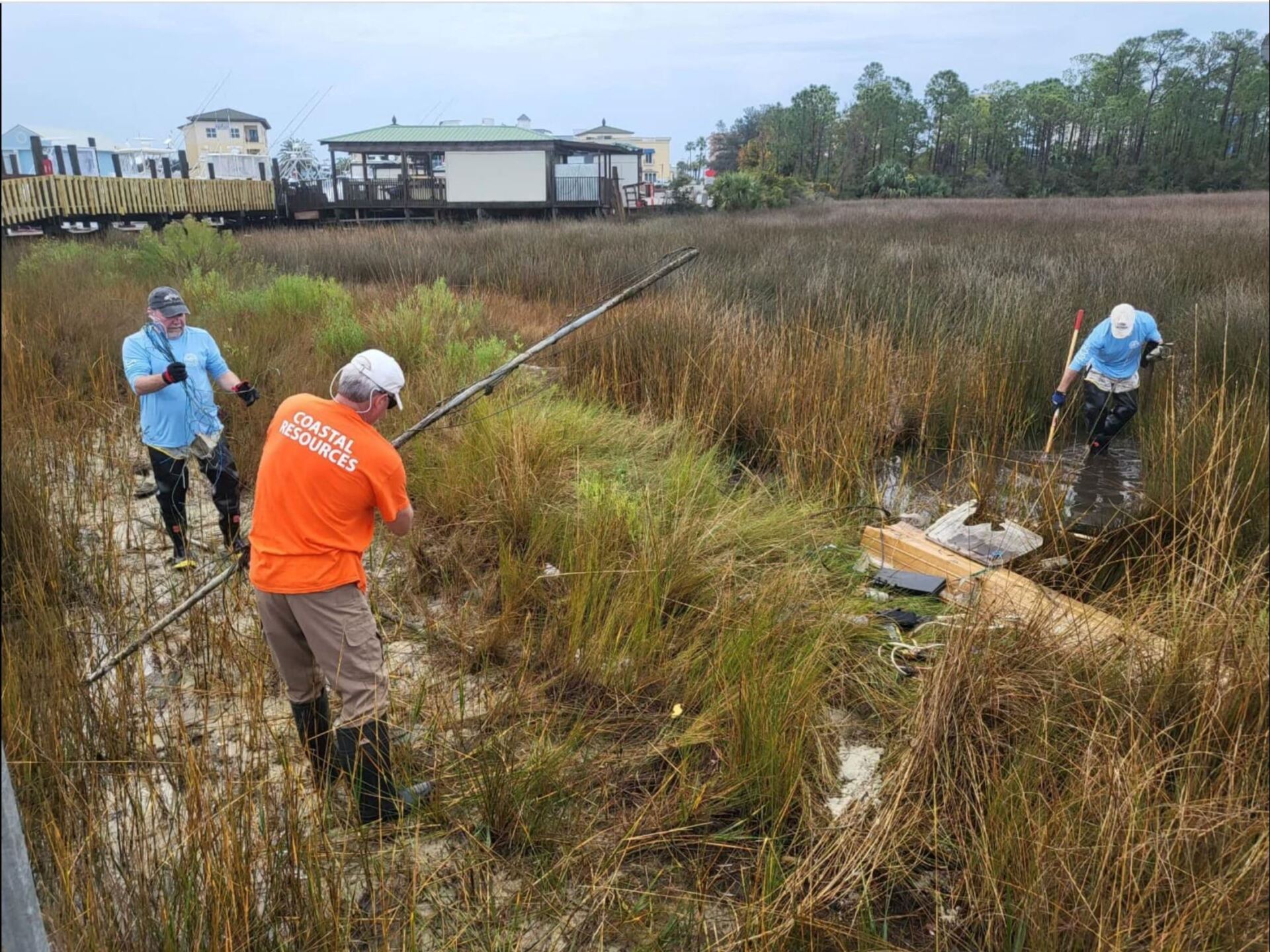 Coastal Resources workers removing debris in Orange Beach, Alabama.