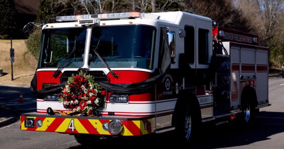 Matt Bradley driving Hoover Fire Department Engine 4 with his father's casket on the back.