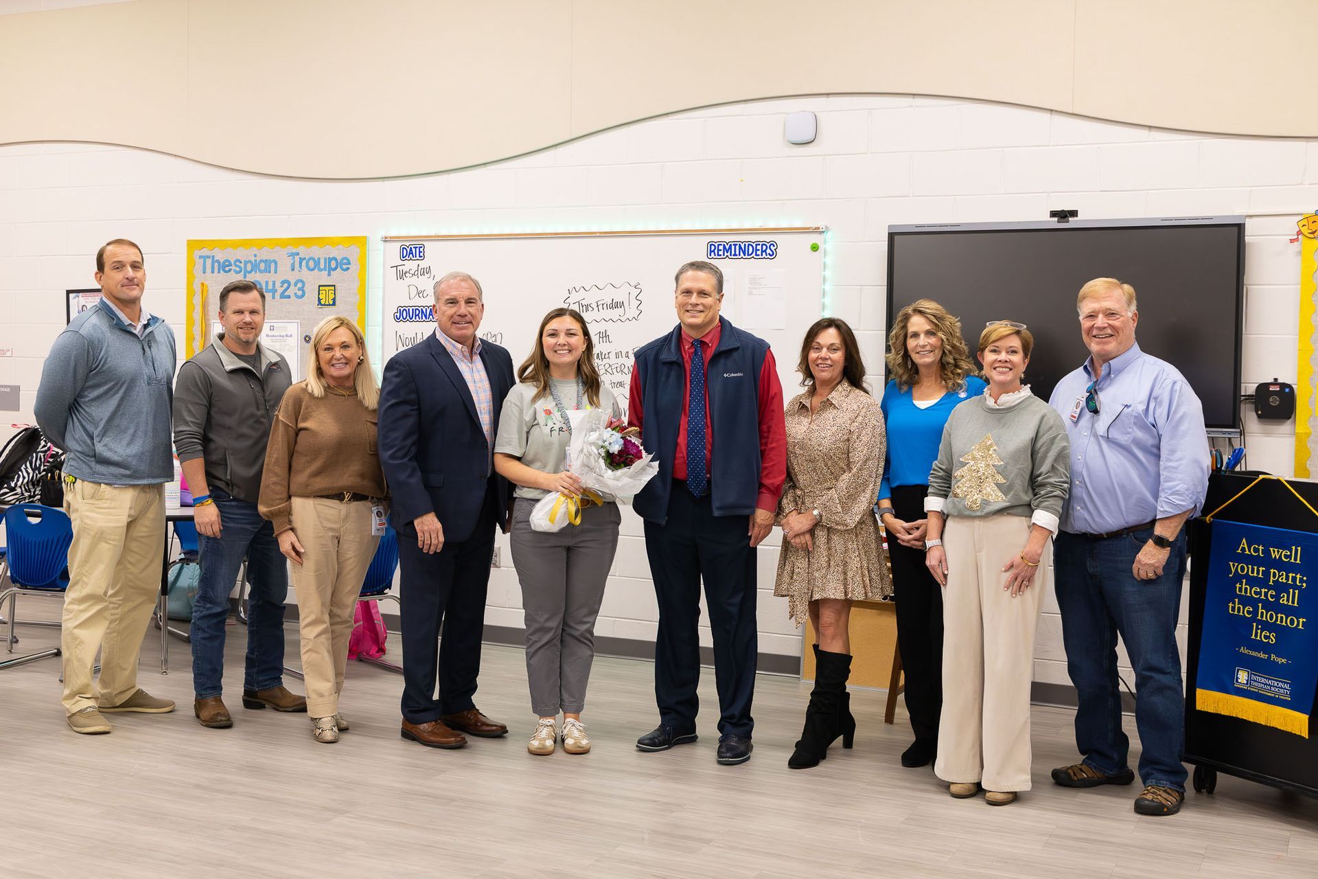 Superintendent and board members visit campuses to surprise four dedicated employees