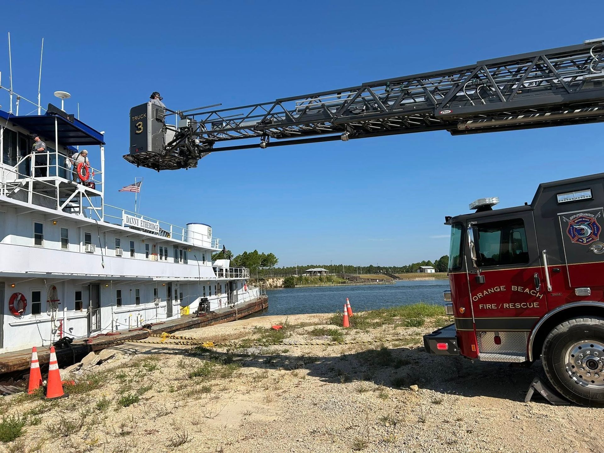Orange Beach Firefighters Use Ladder Truck to Rescue Patient on Tugboat