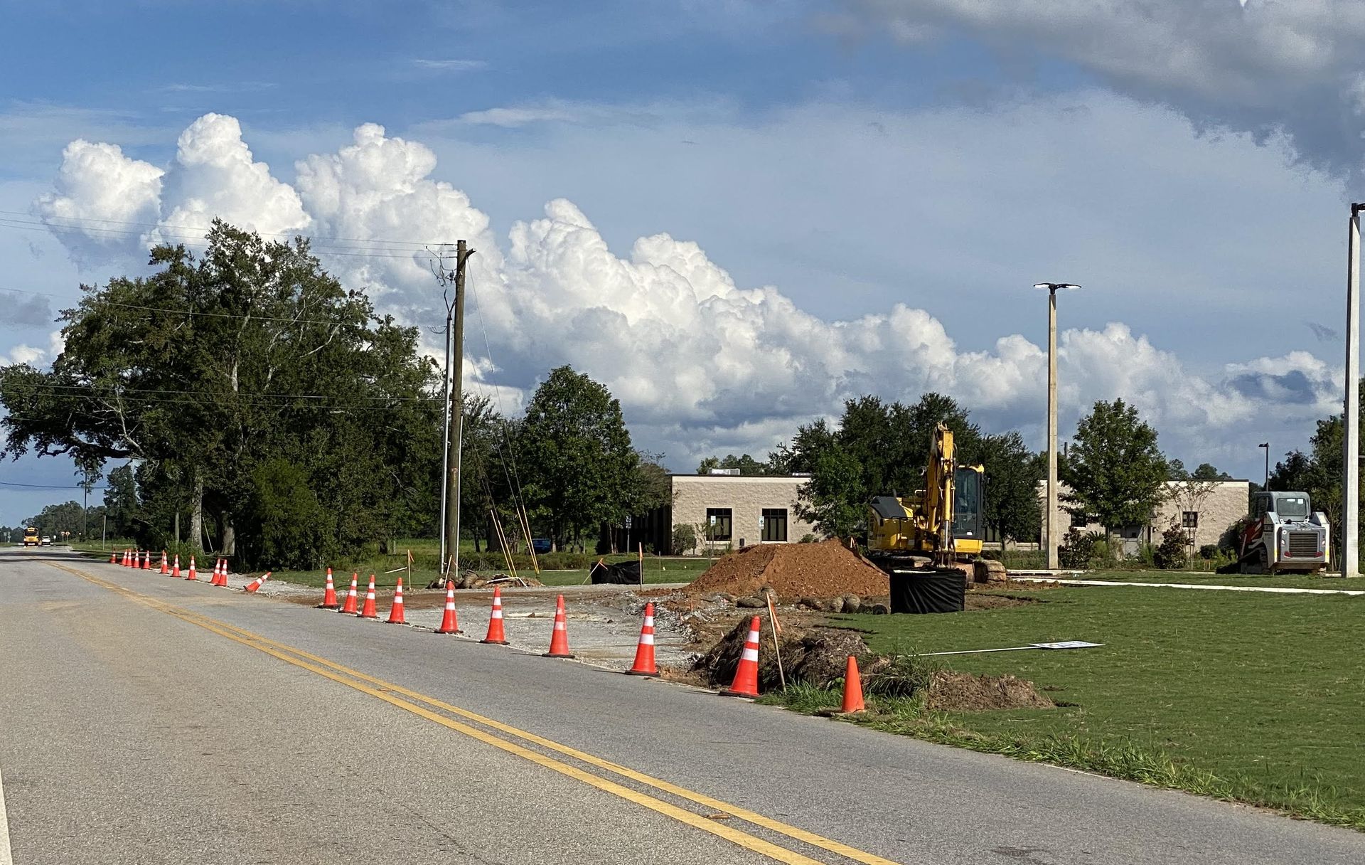 A parking lot entrance is constructed across a right of way on a Foley street. The city has updated its permit requirements for work conducted on municipal rights of way. 