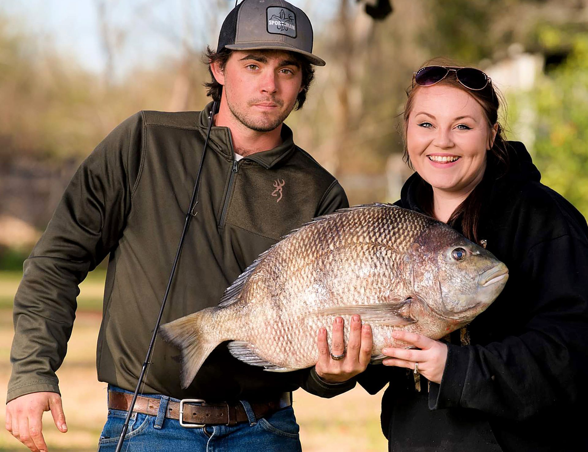 Kendale Jeans and her husband, Donovan, show off the state record sheepshead. Photo by Earl Wyant