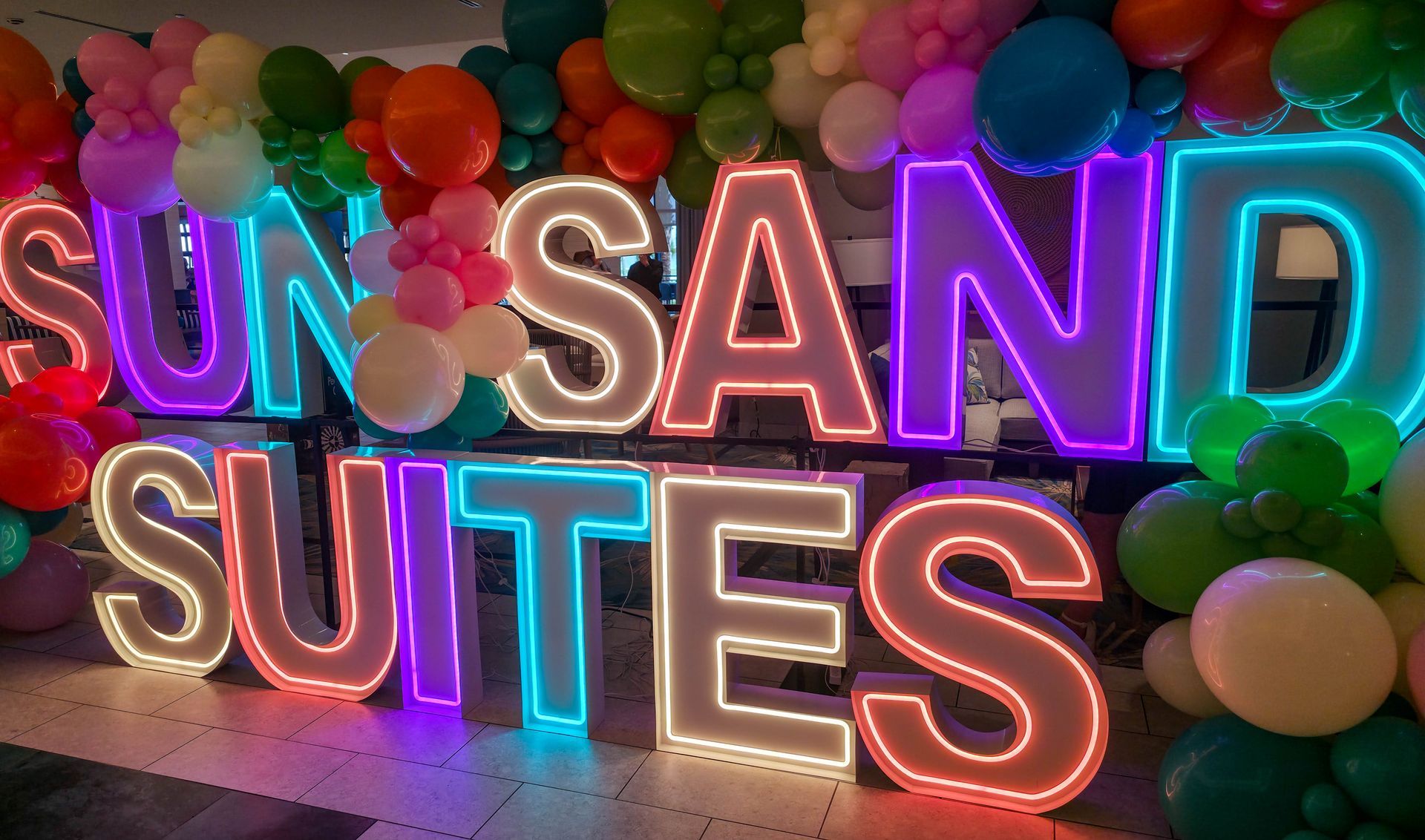 Sun, sand and Suites sign.