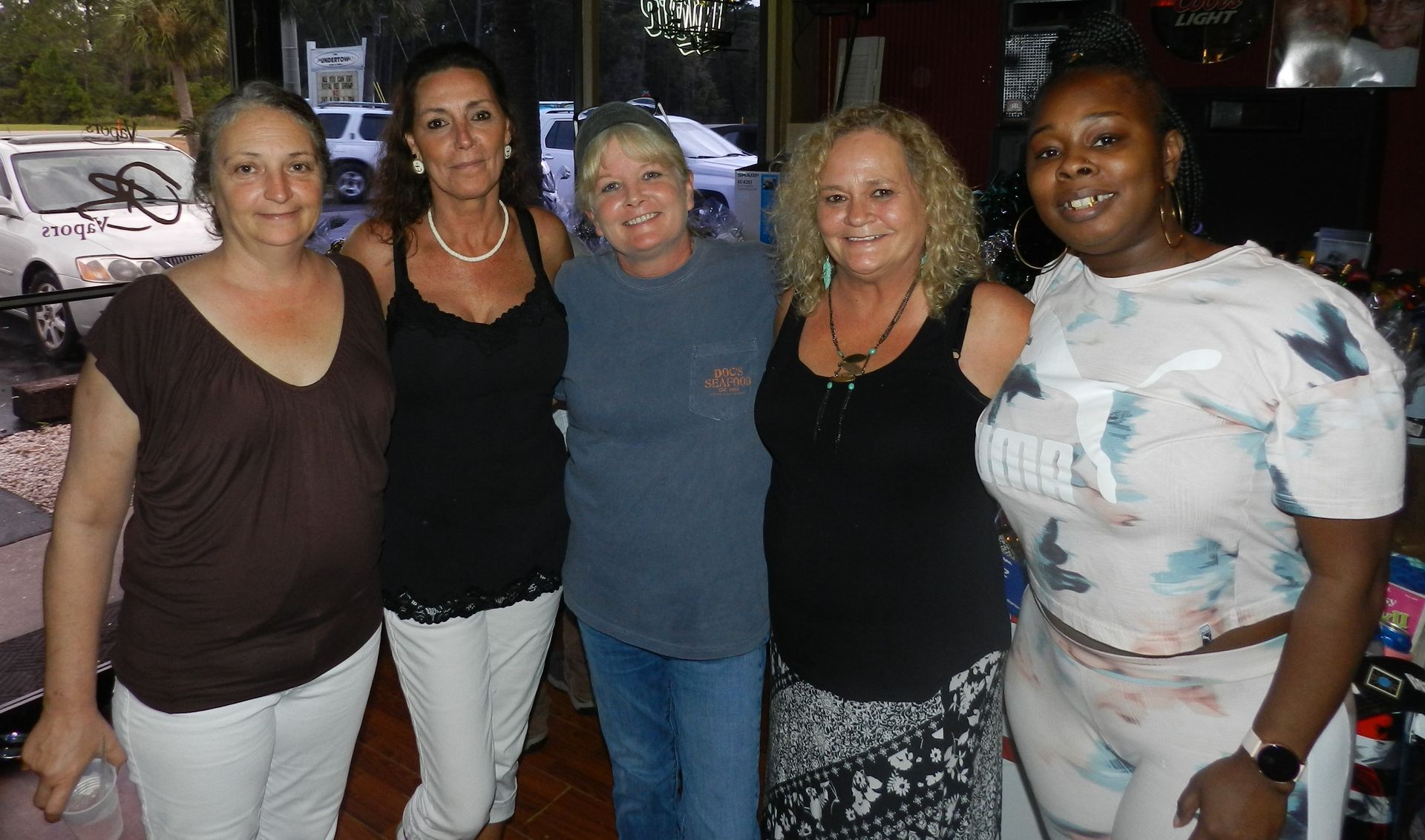 Susan Anderson, center, at a fundraiser she helped organize for a co-worker whose husband had passed