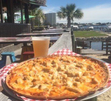 Pleasure Island Tiki Bar in Orange Beach, Alabama offers a variety of pizzas.
