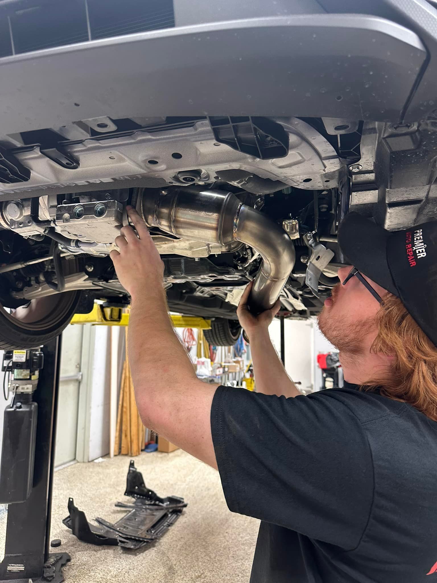 Mechanic Installs an Exhaust Pipe | Premier Auto Repair