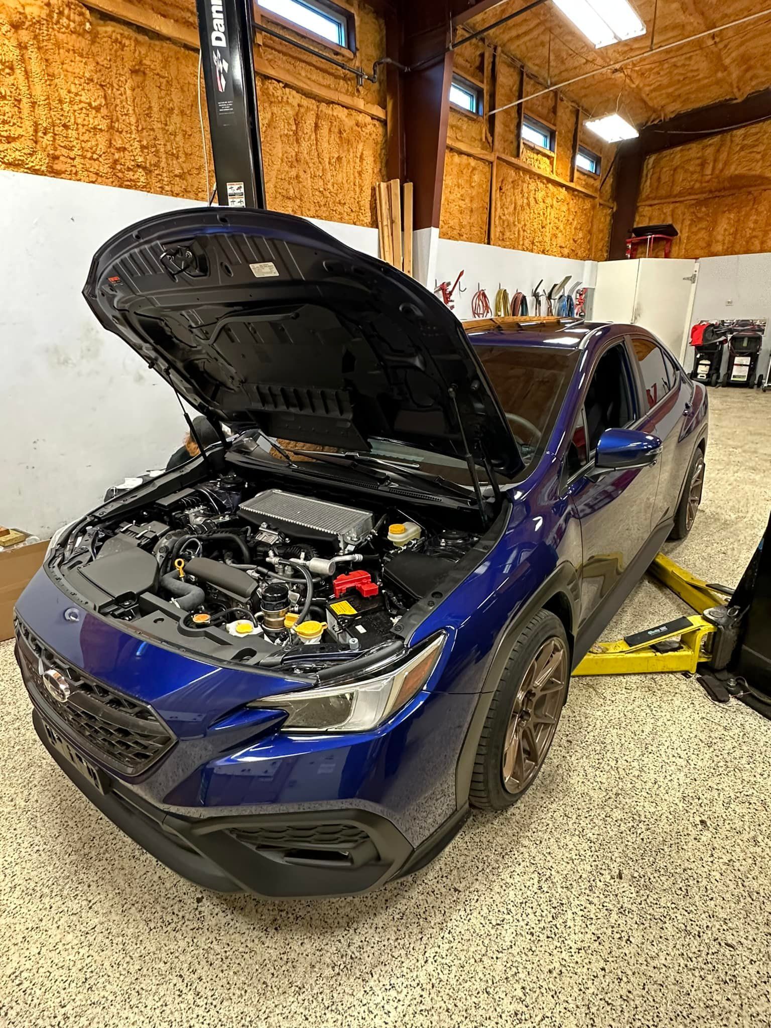Blue Subaru Car With Hood Open | Premier Auto Repair