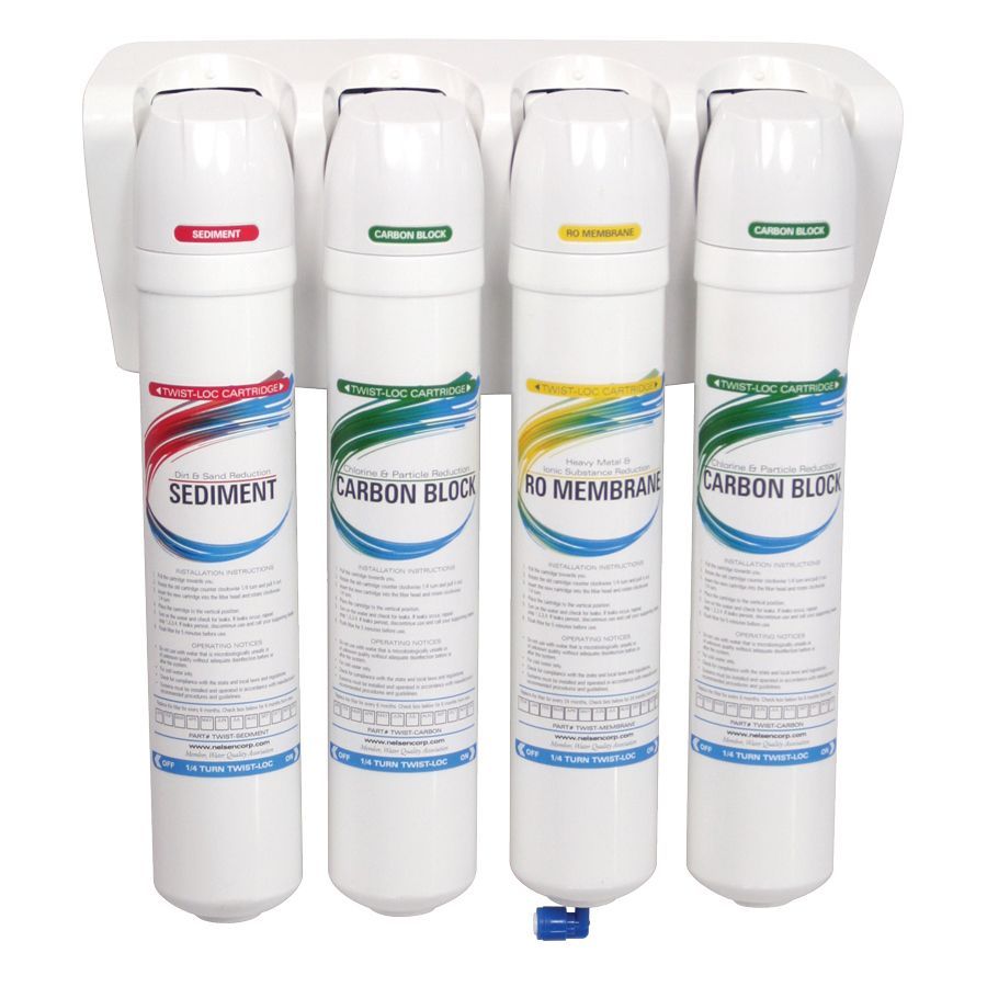 A water filter with four cartridges attached to it.