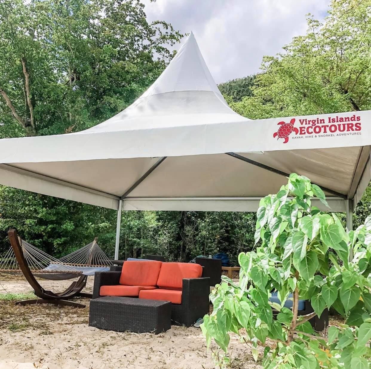 A white tent with virgin islands ecotours written on it