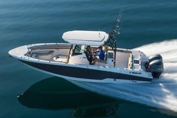 A boat is floating on top of a body of water.